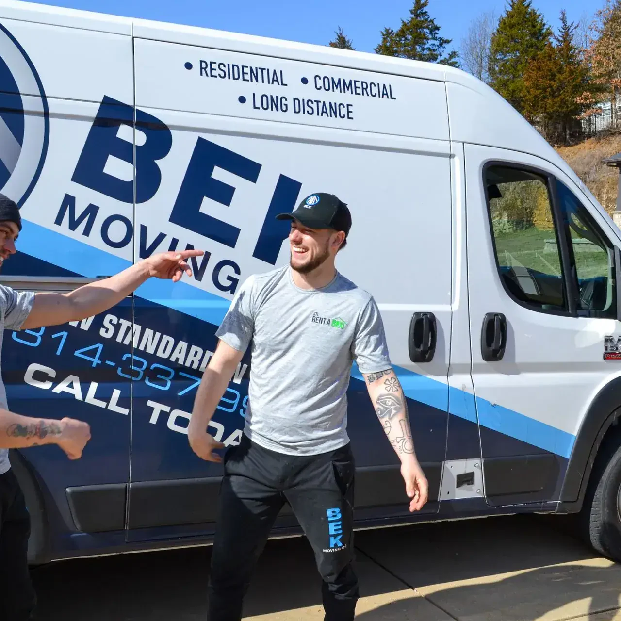 bek rentabox movers laughing near moving van bek rentabox movers laughing near moving van