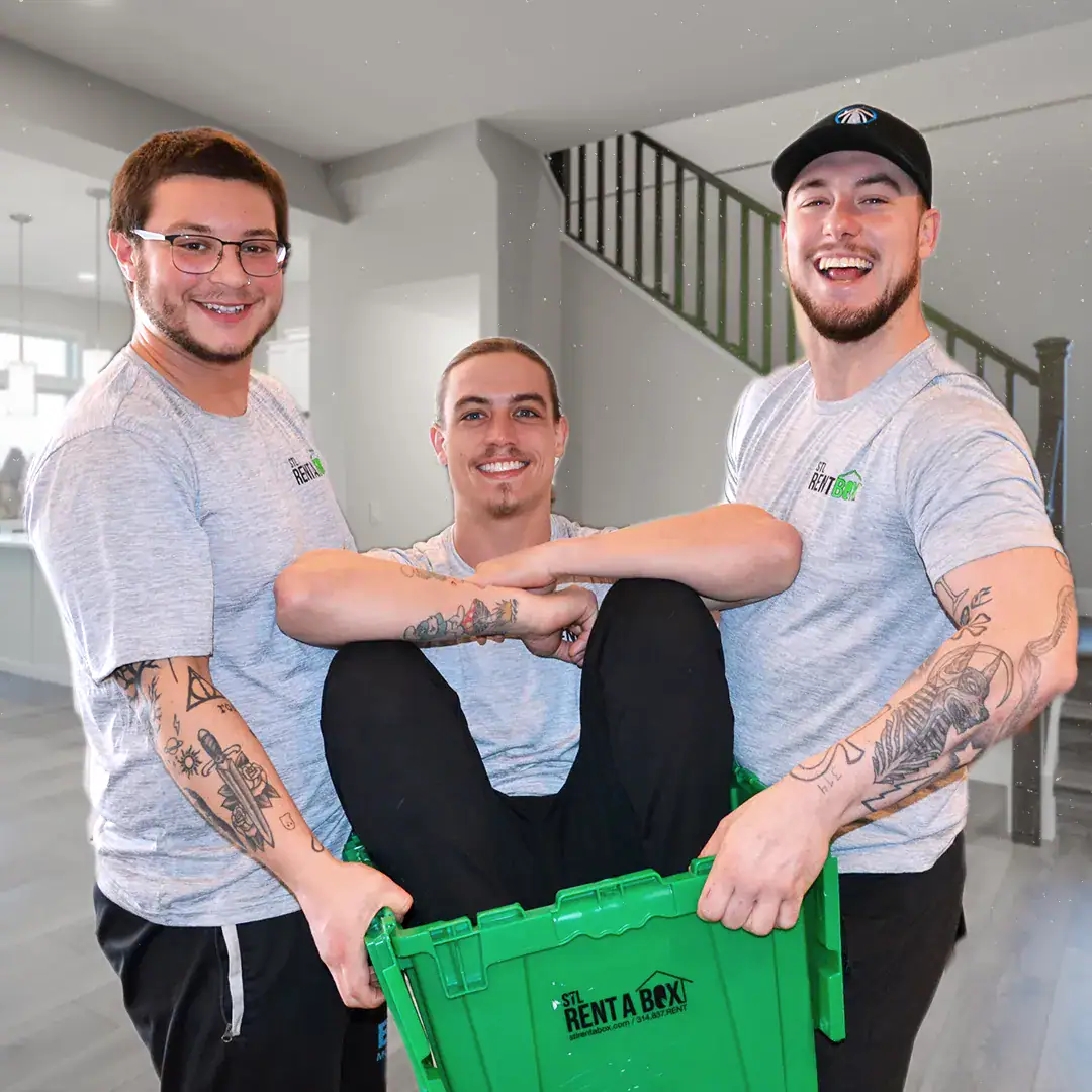 stl rentabox team fun photo green box Three smiling movers with green rental box.